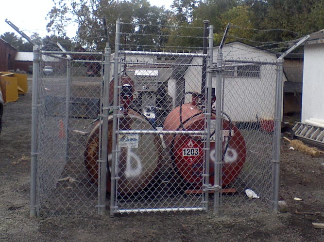 We built this chain link fence in a commercial location to protect fuel tanks